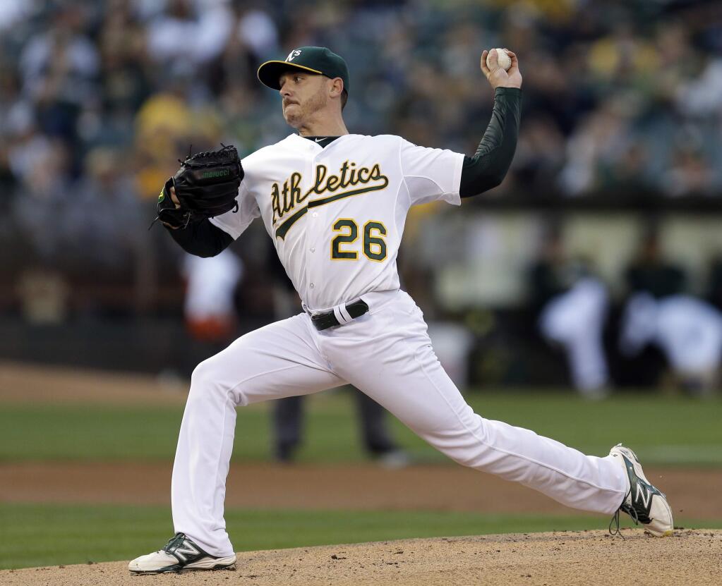 Oakland Athletics' Scott Kazmir works against the New York Mets in the first inning of a baseball game Tuesday, Aug. 19, 2014, in Oakland, Calif. (AP Photo/Ben Margot)