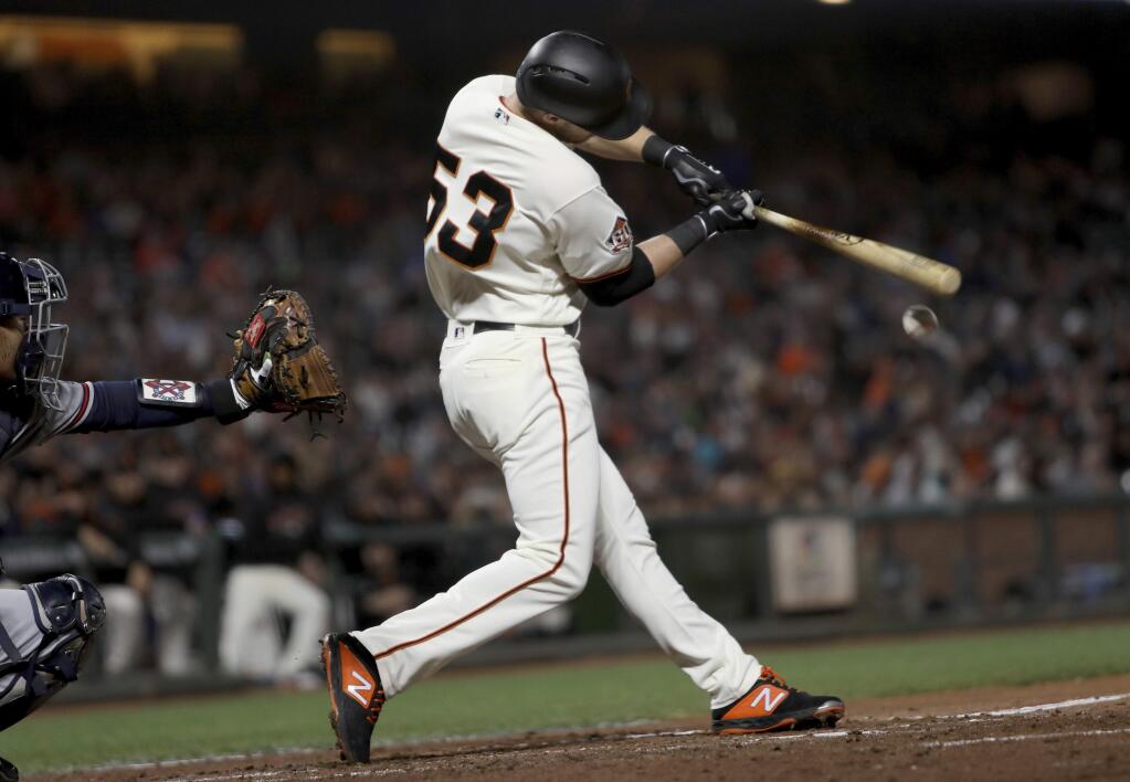 San Francisco Giants' Austin Slater (53) connects for an RBI single in the third inning of a baseball game against the Atlanta Braves in San Francisco, Monday, Sept. 10, 2018. (AP Photo/Scot Tucker)