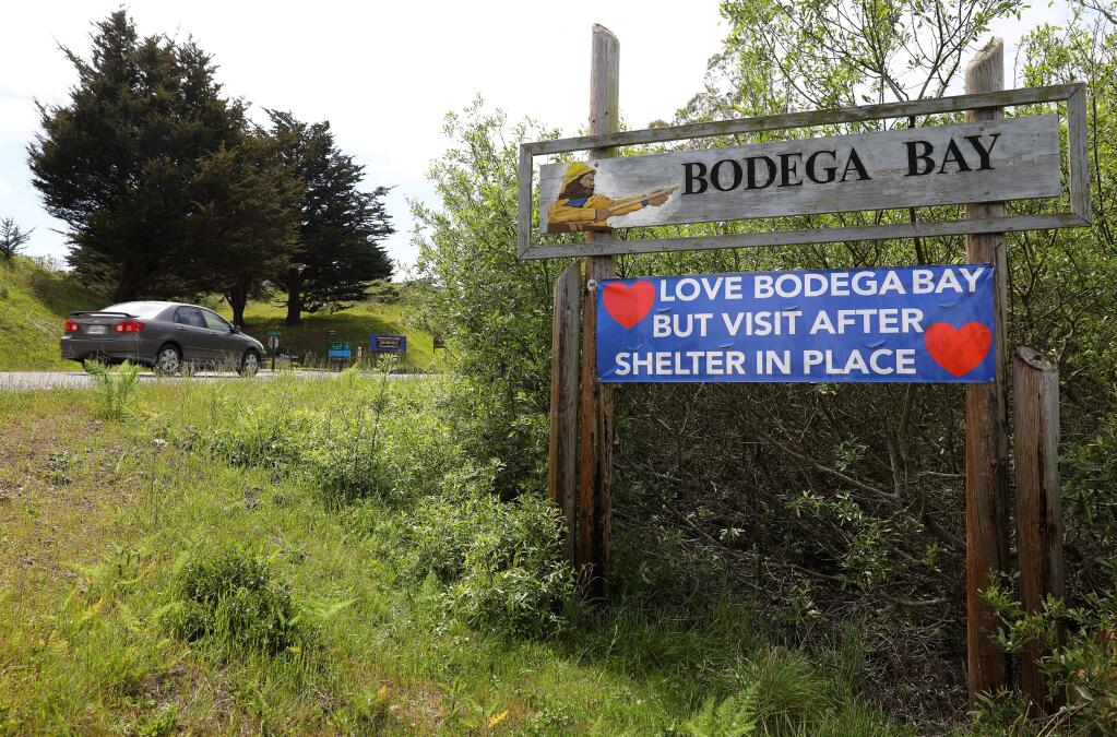 A sign reminding visitors of the shelter in place order greets motorists along Highway 1 in Bodega Bay on Monday, April 20, 2020. (Christopher Chung/ The Press Democrat)