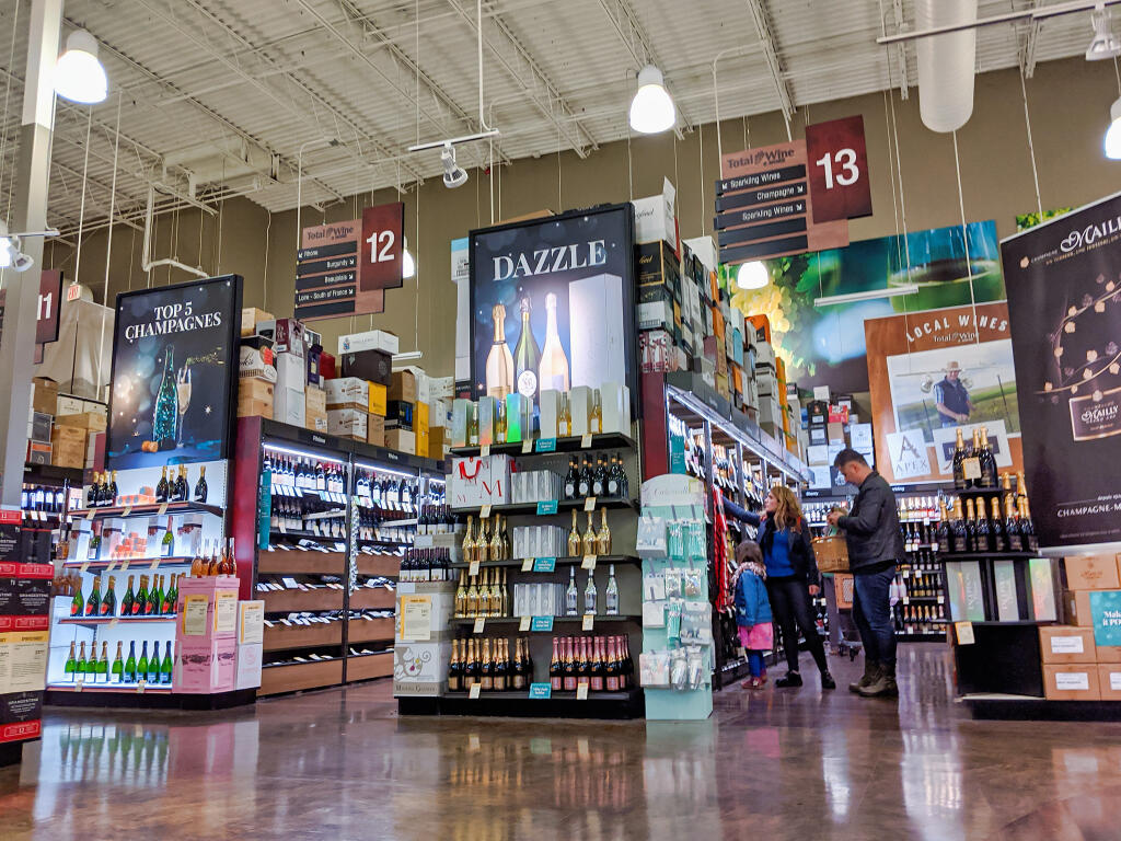 A family shops for wine inside the Total Wine & More store in downtown Bellevue, Washington, in October 2019. (Colleen Michaels / Shutterstock)