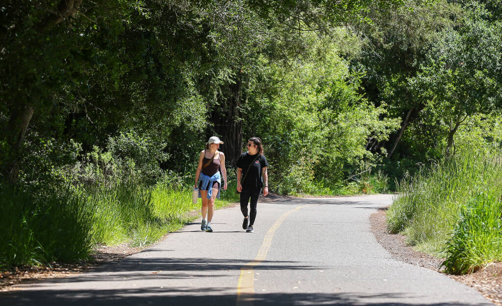 Grace Savelli, left, and Valerie Dowd walk around Spring Lake Regional Park in Santa Rosa, Tuesday, May 16, 2023. (Christopher Chung / The Press Democrat file)