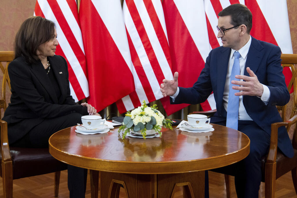 Poland's Prime Minister Mateusz Morawiecki, right, speaks with US Vice President Kamala Harris during a meeting, in Warsaw, Poland, Thursday, March 10, 2022. (Saul Loeb/Pool Photo via AP)