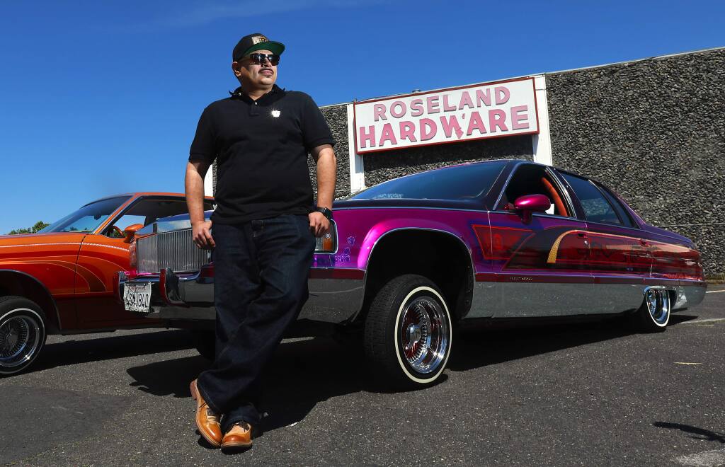 Gustavo Mendoza grew up in Roseland and manages California Youth Outreach, but in his spare time he rebuilds and airbrushes lowriders, including his 'El Mojado.' (John Burgess/The Press Democrat)
