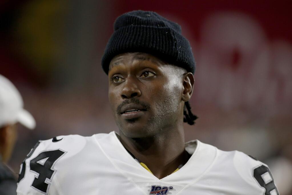 Oakland Raiders wide receiver Antonio Brown watches from the sideline during the second half of a preseason game against the Arizona Cardinals, Thursday, Aug. 15, 2019, in Glendale, Ariz. (AP Photo/Rick Scuteri)