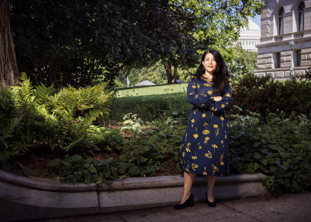 In this undated photo provided by the Library of Congress, Ada Limón poses for a portrait in Washington. On Tuesday, July 12, 2022, the Library of Congress announced that Limón had been named the 24th U.S. poet laureate, officially called the Poet Laureate Consultant in Poetry. Her one-year term begins Sept. 29 with the traditional reading at the Library’s Coolidge Auditorium. (Shawn Miller/Library of Congress via AP)
