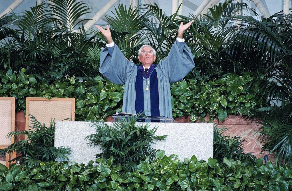 FILE - In this Jan. 28, 1996, file photo, Rev. Robert H. Schuller, pastor of the Crystal Cathedral in Garden Grove, Calif., speaks at the church. Schuller, the Southern California televangelist who brought his message of 'possibility thinking' to millions, died early Thursday, April 2, 2015, in California. He was 88. (AP Photo/Michael Tweed, File)