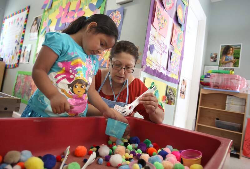 Teacher Francisca Farias interacts with Ashley Molina at A Special Place preschool, in Santa Rosa in 2013. (CHRISTOPHER CHUNG/ PD FILE)