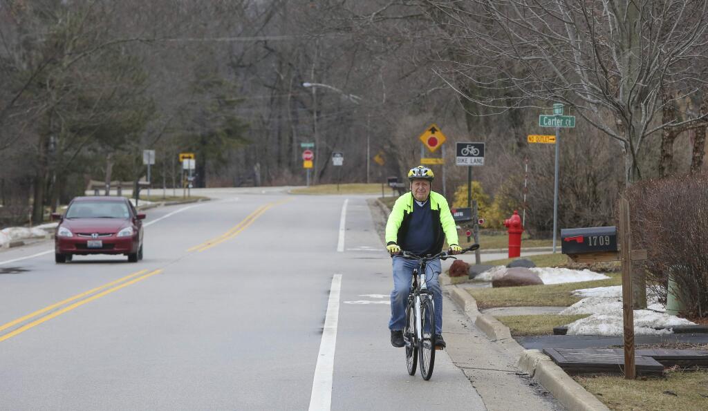 Bill Gurolnick rides his bike near his home in Northbrook, Ill., on Feb. 20, 2018. Gurolnick, who turns 87 in March 2018, is participating in a study at Northwestern University that researchers hope will help them understand why some people in their 80s and 90s are able to keep the same sharp memory as someone 20 or 30 years younger. (AP Photo/Teresa Crawford)