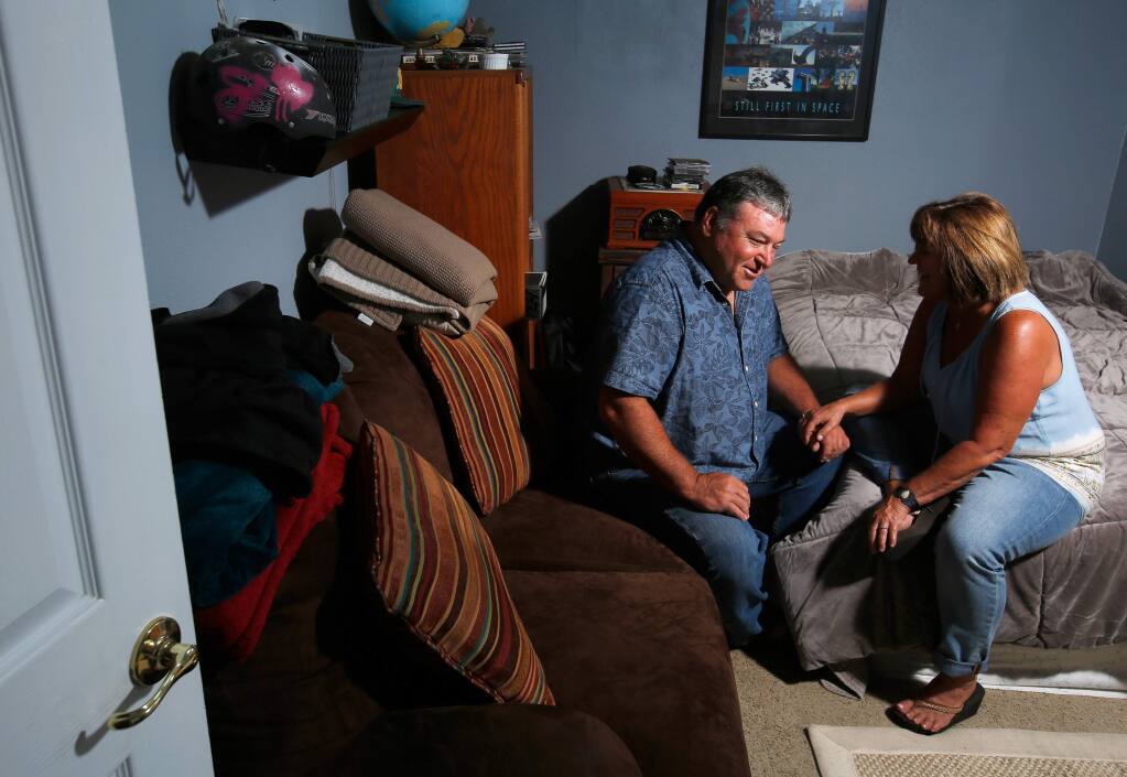 Eric and Connie Petereit talk with each other in their son's bedroom, at their home in Healdsburg, California on Thursday, August 24, 2017. Eric and Connie's son was diagnosed with schizophrenia in 2013, when he was 19 years old. (Alvin Jornada / The Press Democrat)