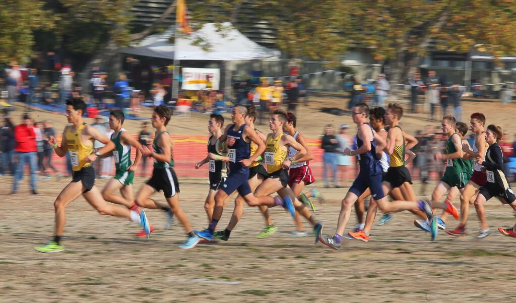 The NCS Cross County Championship division three boys race gets underway at Hayward High Schook on Tuesday, November 20, 2018. (Christopher Chung/ The Press Democrat)