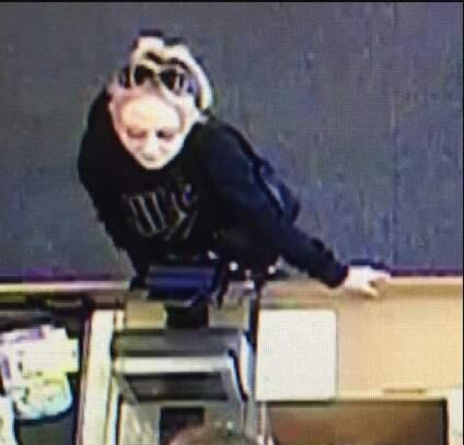 Petaluma police are trying to identify a suspected credit card thief who had long pink fingernails and a large black purse. (COURTESY OF PETALUMA POLICE DEPARTMENT)