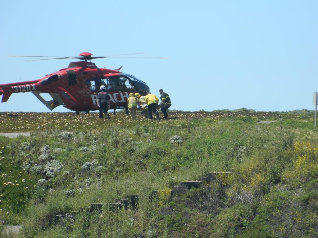 Rescue crews help a man who crashed his pickup truck off a cliff at at Duncans Landing on Saturday, May 13, 2017. (COURTESY OF PAT PATERSON)