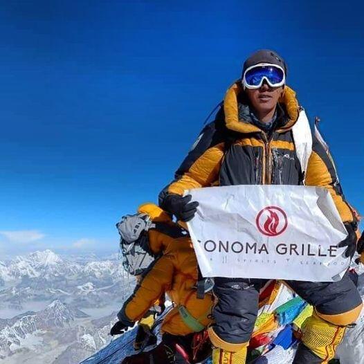 Pasang Tshering Sherpa summited Mount Everest on May 15, flying the Sonoma Grille flag. (Sonoma Grille / Facebook)