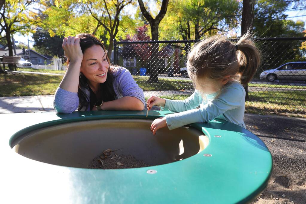 Santa Rosa City Council member Victoria Fleming plays with her 4-year-old daughter, Evie, at Humboldt Park in Santa Rosa on Wednesday, Nov. 7, 2018. (Christopher Chung/ The Press Democrat)