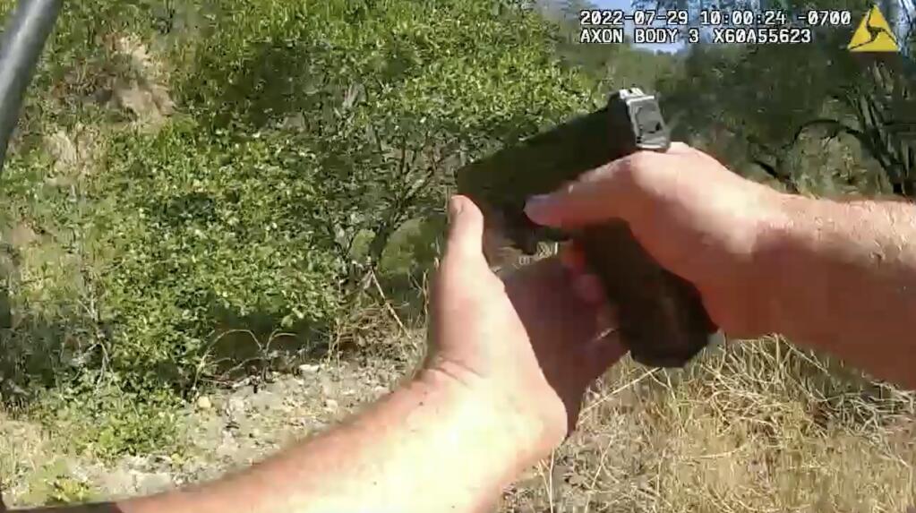 A Sonoma County sheriff’s deputy is seen raising his gun in body camera footage July 29 while in pursuit of farmworker David Pelaez-Chavez, who was later fatally shot by a deputy. (Courtesy)
