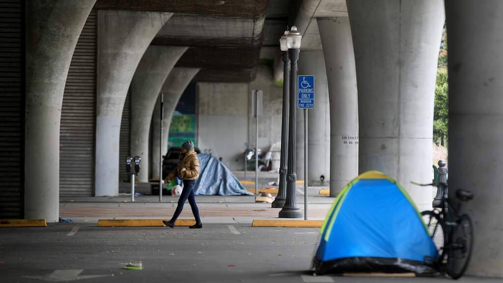 From West Ninth Street south to Third Street, homeless individuals are using the underpass, sidewalks, and parking lots to set up their camps, Saturday, April 18, 2020 in Santa Rosa. (Kent Porter / The Press Democrat) 2020