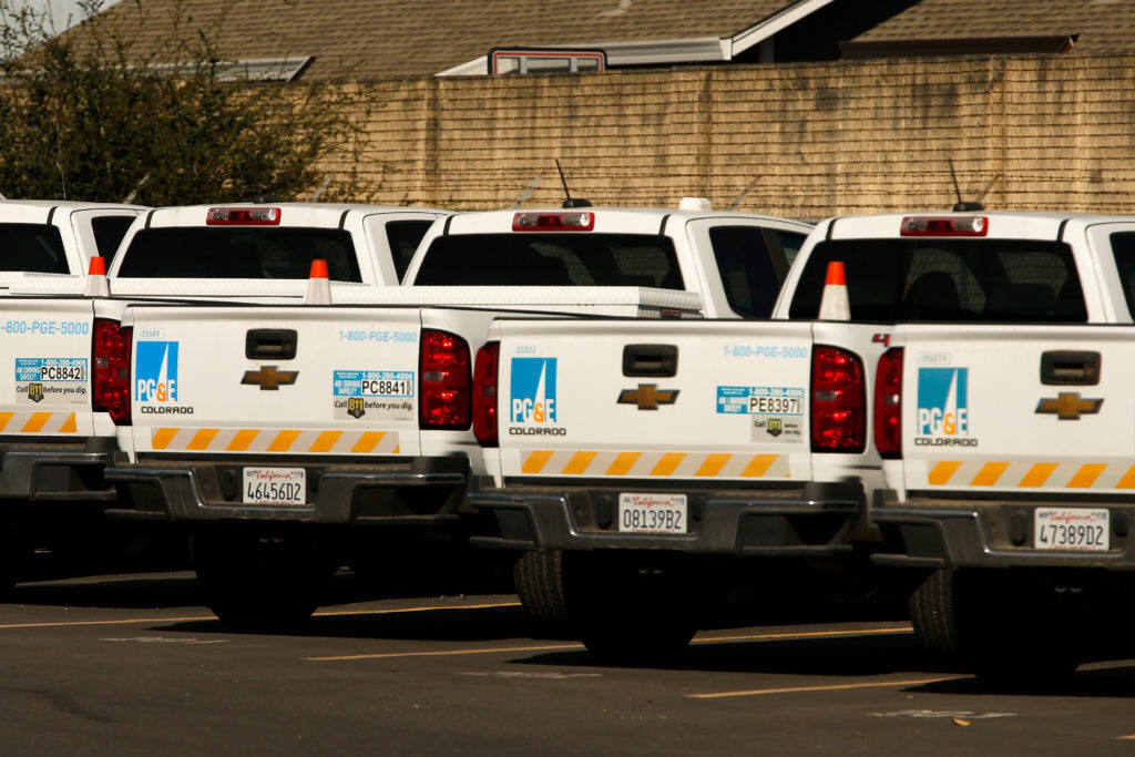Pacific Gas and Electric trucks are seen parked at the PG&E service center on Occidental Road, on the second day of the public safety power shutoff to mitigate wildfire risk, in Santa Rosa, California, on Thursday, Oct. 10, 2019. (Alvin Jornada / The Press Democrat)