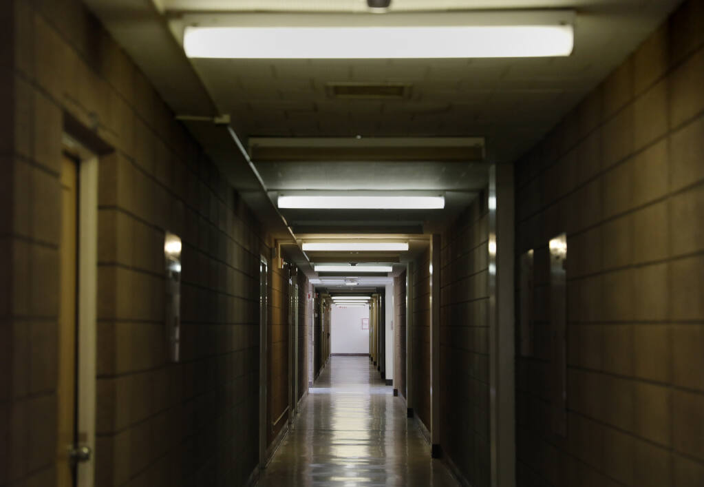 A hallway inside the administration building at the former Sonoma Developmental Center in Glen Ellen, California, on Wednesday, November 10, 2021. (Beth Schlanker/The Press Democrat)
