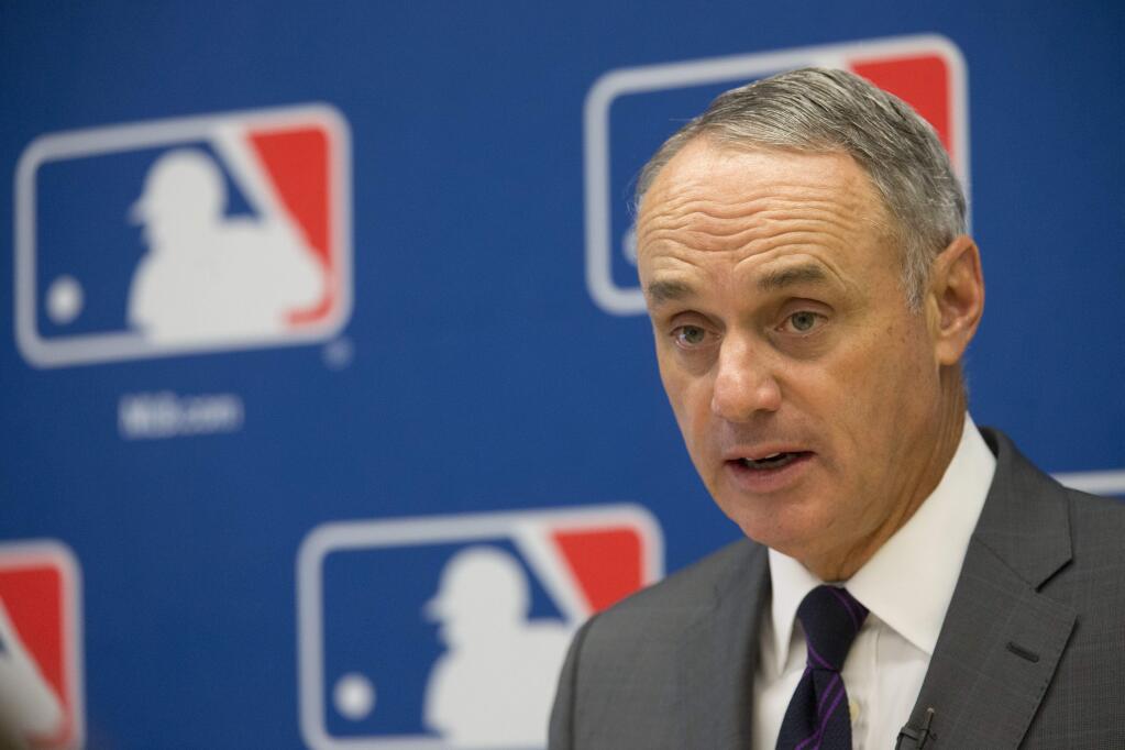 FILE - In this May 19, 2016, file photo, Baseball Commissioner Rob Manfred speaks to reporters during a news conference at Major League Baseball headquarters in New York. Manfred says more rule changes are needed to improve the pace of play, and one proposal under consideration is a limitation on relief pitching changes in an inning or a game.The majors shaved several minutes off the average game time last season, but games have been slightly longer in 2016. (AP Photo/Mary Altaffer, File)