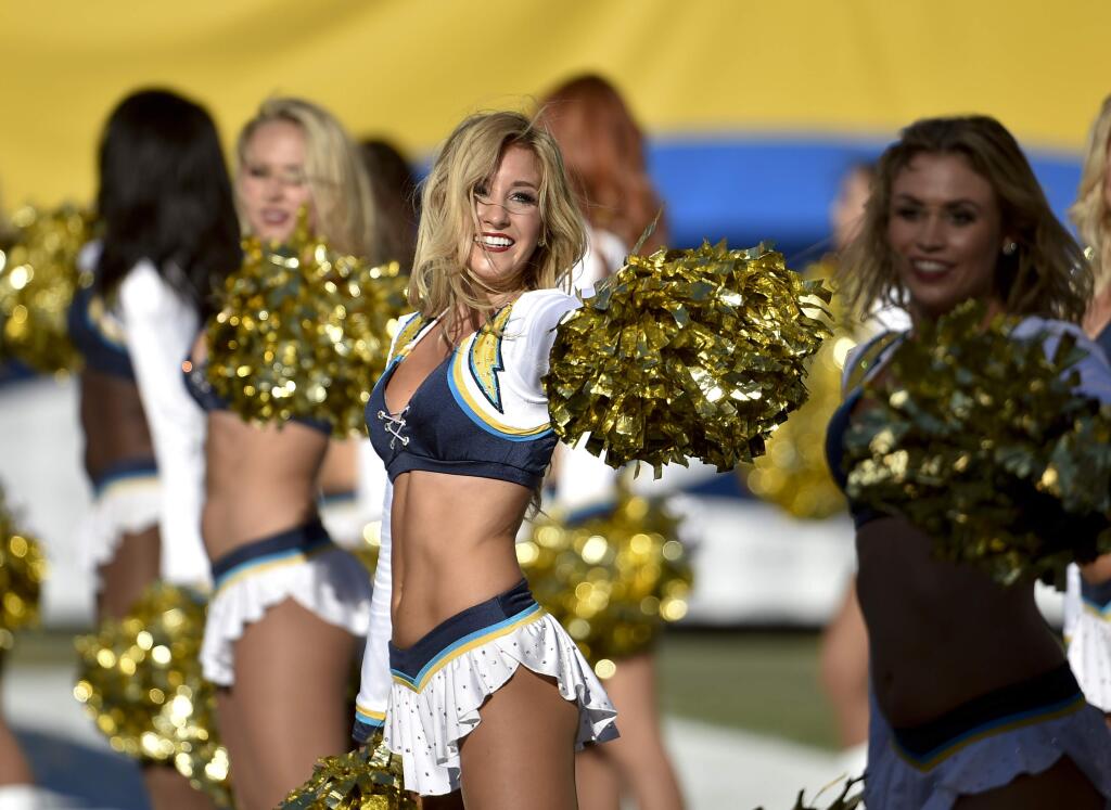 San Diego Chargers cheerleaders perform during the first half of an NFL football game between the San Diego Chargers and the St. Louis Rams Sunday, Nov. 23, 2014, in San Diego. (AP Photo/Denis Poroy)