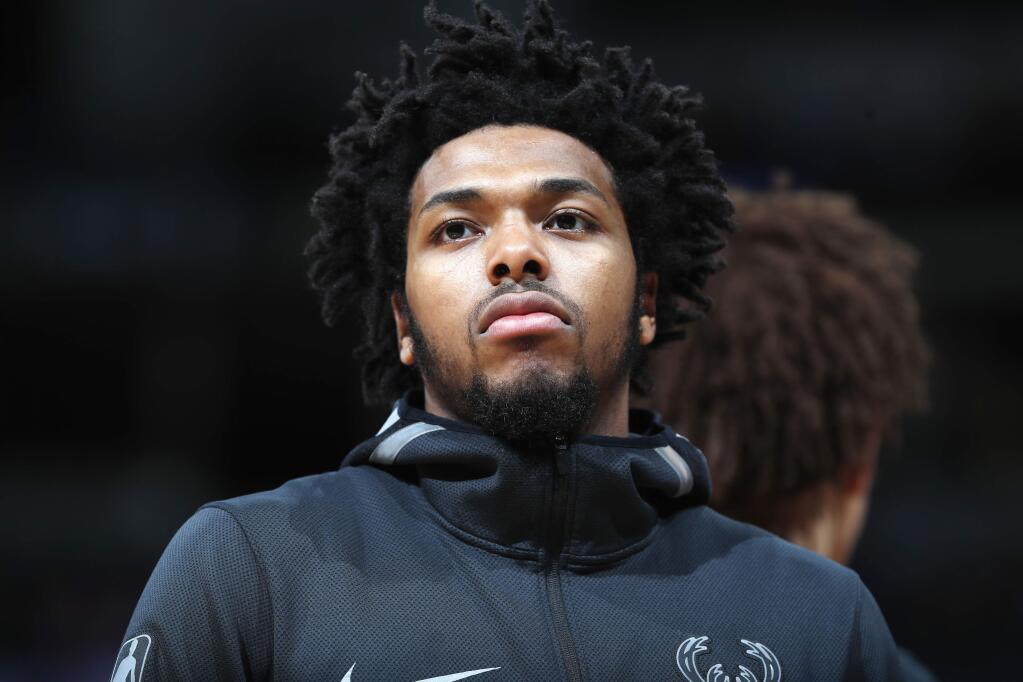 FILE - In this April 1, 2018, file photo, Milwaukee Bucks guard Sterling Brown is seen during an NBA basketball game in Denver. Brown filed a lawsuit Tuesday, June 19, 2018, against the city of Milwaukee and its police department, claiming unlawful arrest and excessive force when officers used a stun gun on him during his arrest in January 2018 for a parking violation. (AP Photo/David Zalubowski, File)
