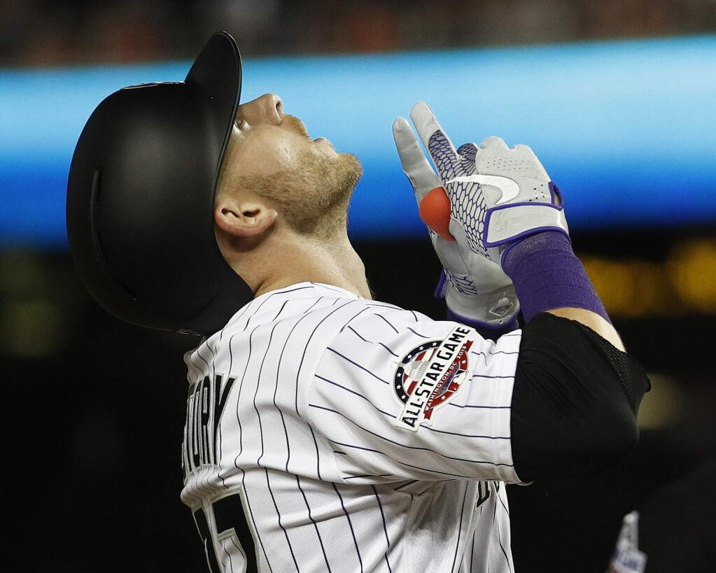 Colorado Rockies shortstop Trevor Story points skyward after his seventh inning solo home run during the Major League Baseball All-star Game, Tuesday, July 17, 2018 in Washington. (AP Photo/Patrick Semansky)