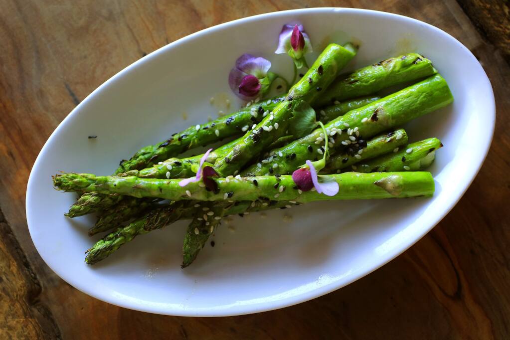 Roasted asparagus with miso dressing and toasted sesame seeds from the Spinster Sisters in the South A district of Santa Rosa. (Photo by John Burgess)