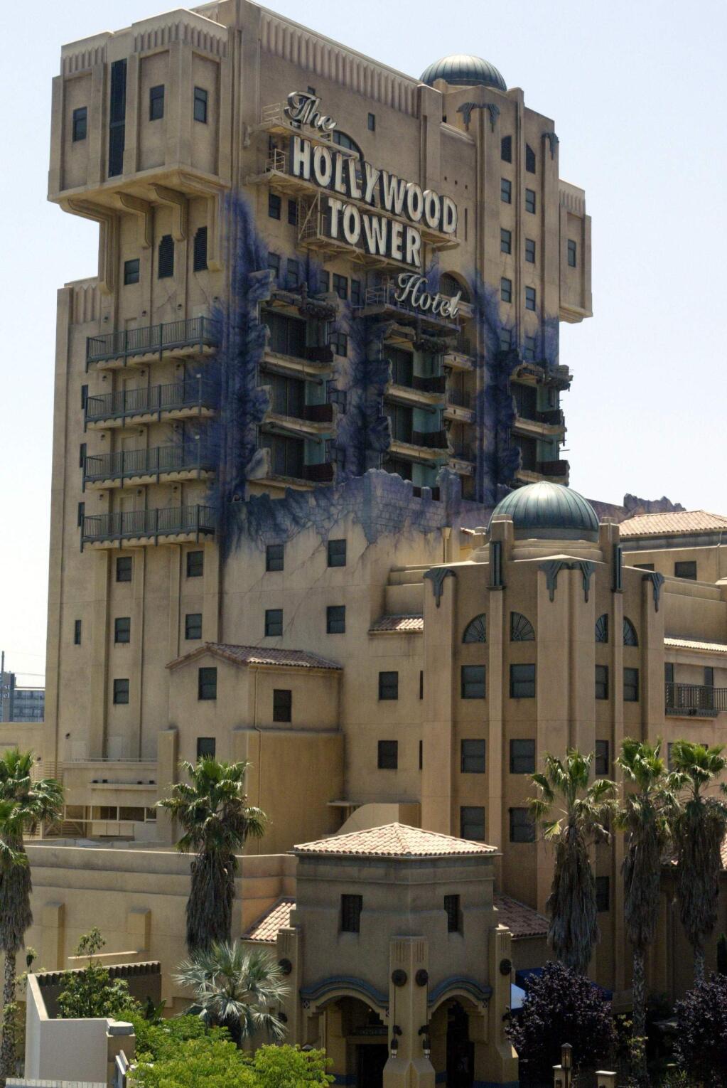 FILE - In this May 4, 2004, file photo, The Twilight Zone Tower of Terror ride at the Disneyland Resort is seen in Anaheim, Calif. Some fans are outraged at the decision to close the ride and revamp it into a 'Guardians of the Galaxy' themed attraction. The plan was greeted with boos when it was announced at the San Diego Comic Con in July 2016. (AP Photo/Damian Dovarganes, File)