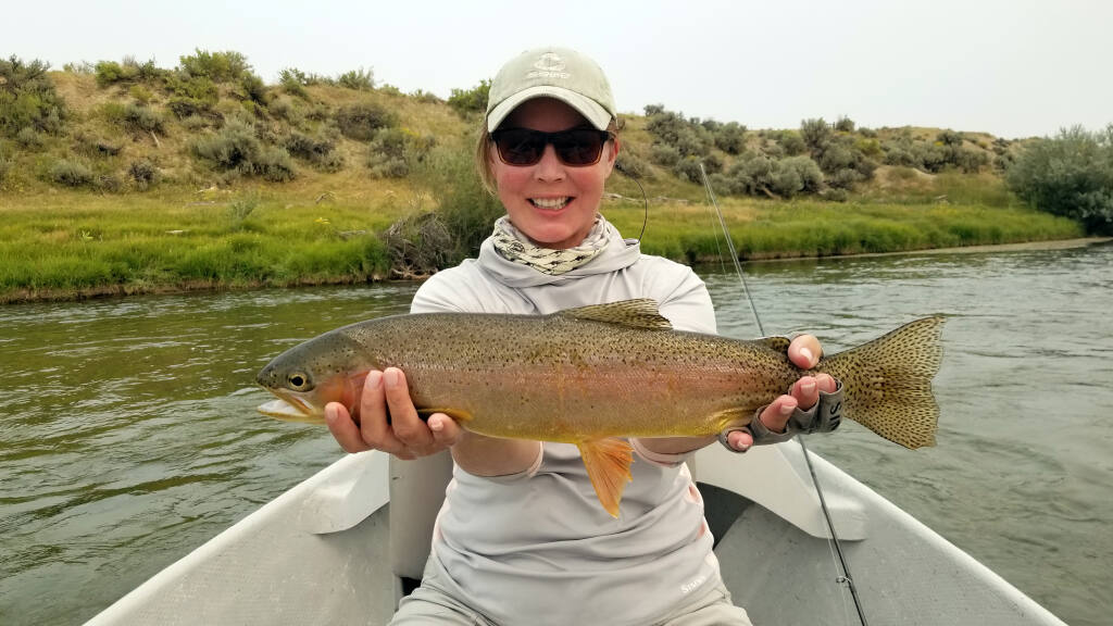 Sonoma's Sydnie Kohara, a former television news reporter, shows off one of many large rainbow trout she caught recently fly-fishing on the North Platte River in Wyoming. (Submitted)