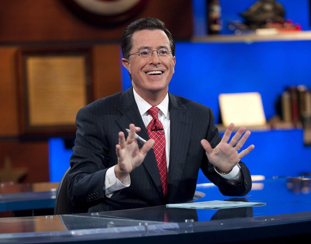 In this Sept. 8, 2010 photo released by Comedy Central, host Stephen Colbert appears during the 'Been There: Won That: The Returnification of the American-Do Troopscapeon' special of 'The Colbert Report,' in New York. 'The Colbert Report' will end on Thursday, Dec. 18, 2014, after nine seasons. (AP Photo/Comedy Central, Scott Gries)