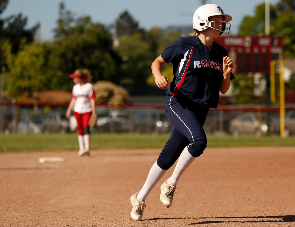 Rancho Cotate's Kaylee Drake (24) heads for third base after hitting a two-run home run during the fourth inning of a varsity softball game between Rancho Cotate and Montgomery high schools in Santa Rosa, California, on Thursday, April 25, 2019. (Alvin Jornada / The Press Democrat)