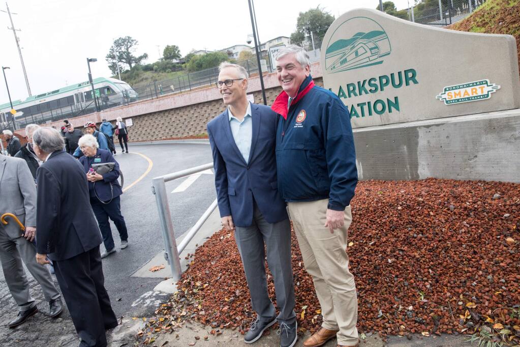 Sonoma County Supervisor David Rabbitt, right, poses for a photo with Congressman Jared Huffman, D-San Rafael, following the ribbon-cutting ceremony for SMART’s Larkspur station in December 2019. (Douglas Zimmerman / Special to the Marin Independent Journal)