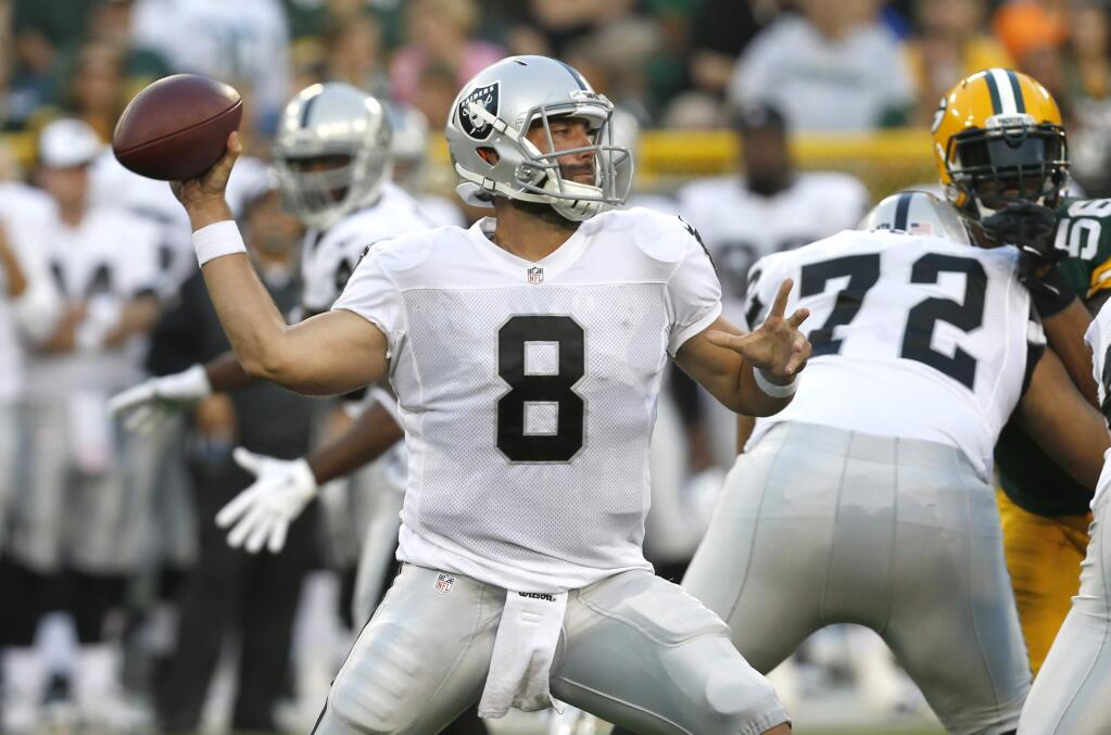 Oakland Raiders quarterback Matt Schaub (8) throws a pass against the Green Bay Packers during the first half of an NFL preseason football game Friday, Aug. 22, 2014, in Green Bay, Wis. (AP Photo/Mike Roemer)