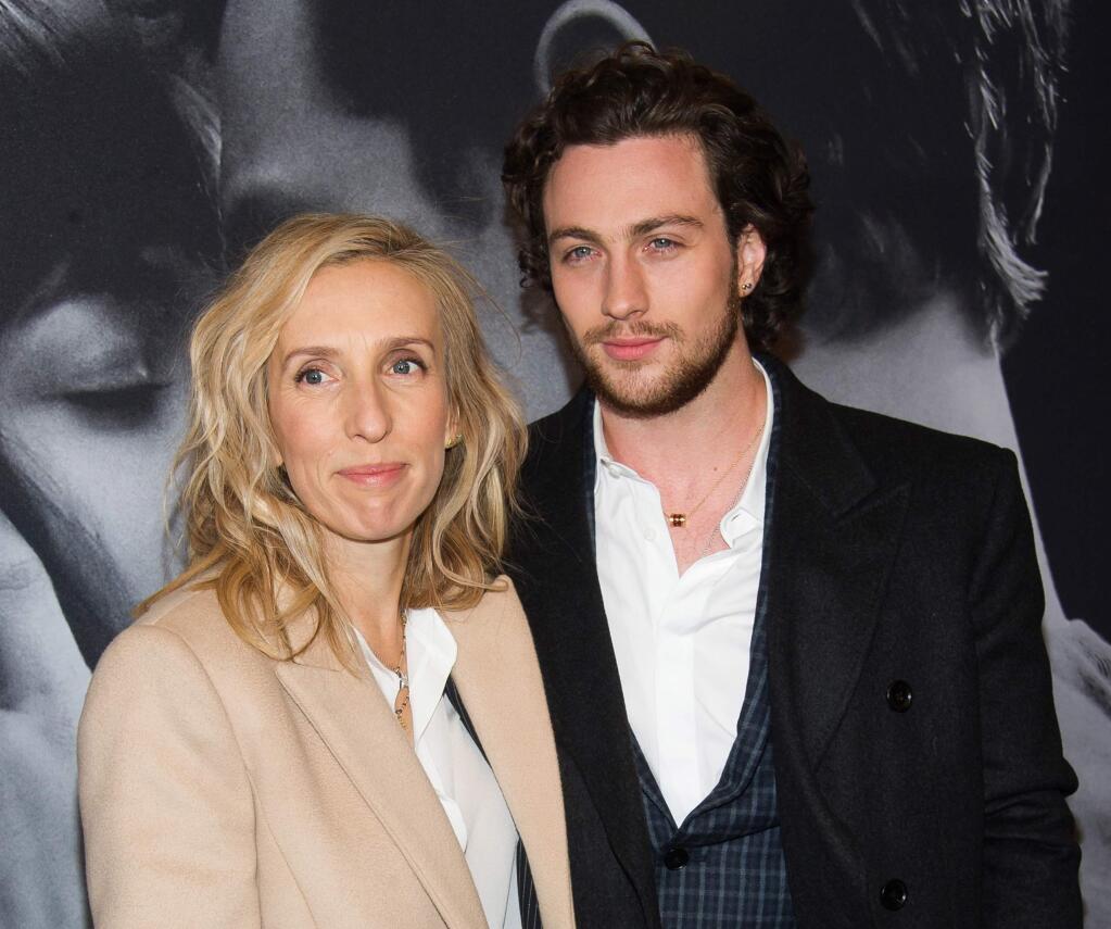 FILE - In this Feb. 6, 2015 file photo, director Sam Taylor-Johnson, left, and Aaron Taylor-Johnson attend a special fan screening of 'Fifty Shades of Grey' hosted by The Today Show at the Ziegfeld Theatre, in New York. Sam Taylor-Johnson will not be returning to direct the sequels to Fifty Shades of Grey, she announced Wednesday night, March 25, 2015. Directing 'Fifty Shades of Grey' has been an intense and incredible journey for which I am hugely grateful, she said in a statement to industry site Deadline in which she thanked Universal Pictures. (Photo by Charles Sykes/Invision/AP, File)