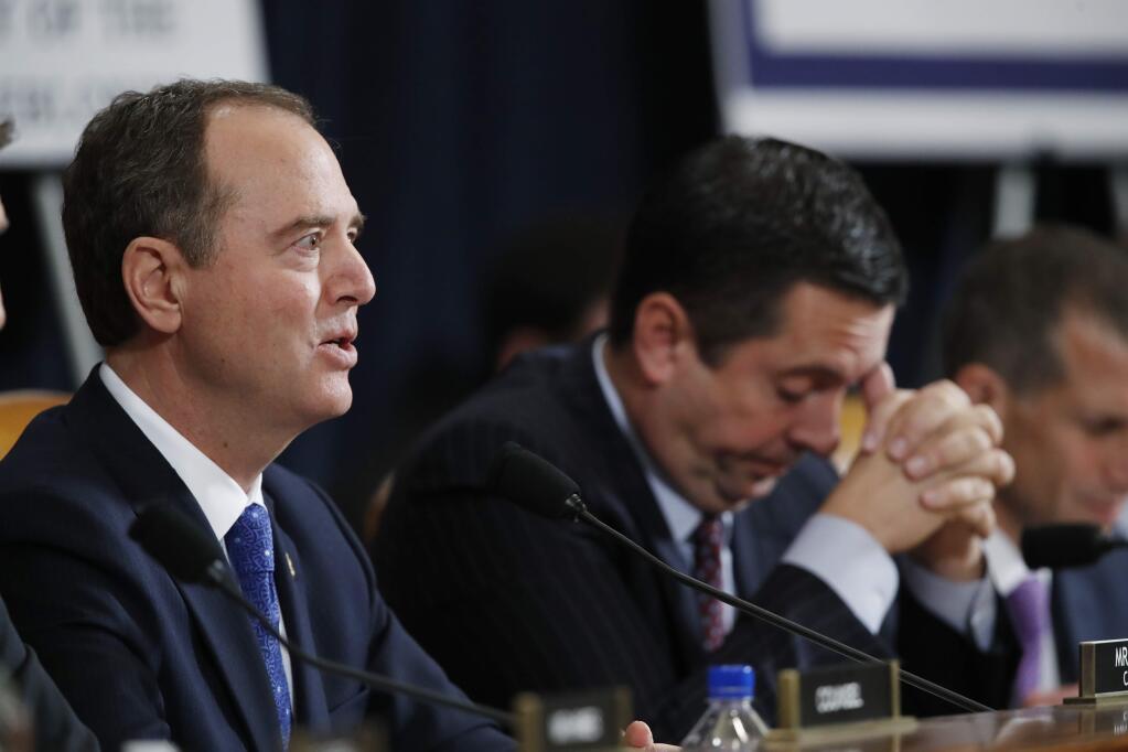House Intelligence Committee Chairman Adam Schiff, D-Calif., left, questions U.S. Ambassador to the European Union Gordon Sondland testifies before the House Intelligence Committee on Capitol Hill in Washington, Wednesday, Nov. 20, 2019, during a public impeachment hearing of President Donald Trump's efforts to tie U.S. aid for Ukraine to investigations of his political opponents, as ranking member Rep. Devin Nunes of Calif., looks on. (AP Photo/Alex Brandon)