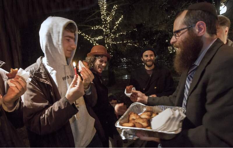 Rabbi Wendel Wolvovsky spread a little latke love at last year's Hanukkah Celebration on the Plaza.