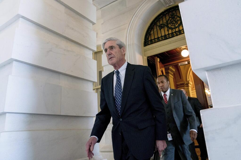 FILE - In this June 21, 2017, file photo, former FBI Director Robert Mueller, the special counsel probing Russian interference in the 2016 election, departs Capitol Hill in Washington. (AP Photo/Andrew Harnik, File)
