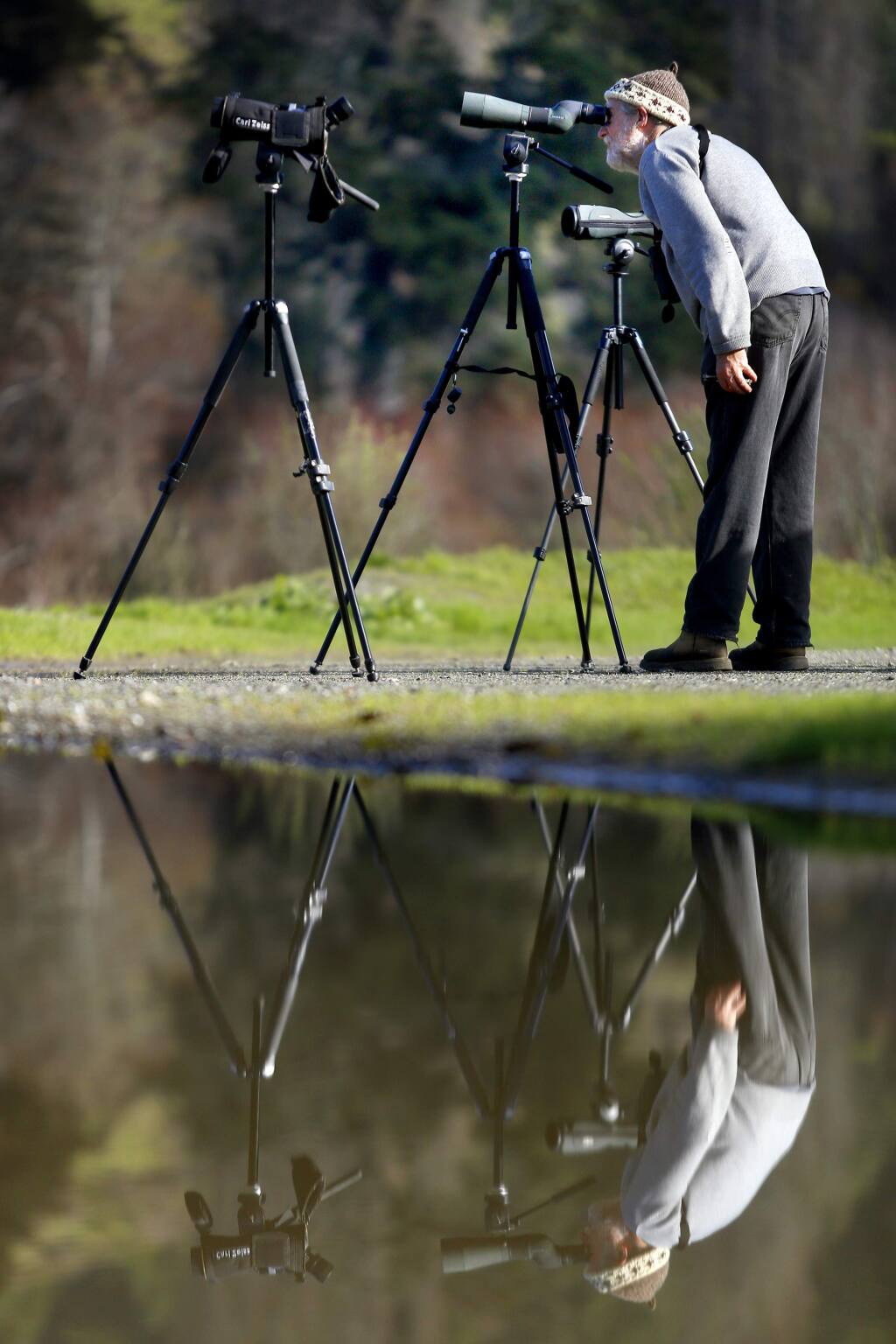Ervand Peterson looks for birds on the Russian River at the Casini Ranch Family Campground as they take part in the take part in the 48th annual West Sonoma County Christmas Bird Count in Duncans Mills, California on Sunday, December 28, 2014. (BETH SCHLANKER/ The Press Democrat)