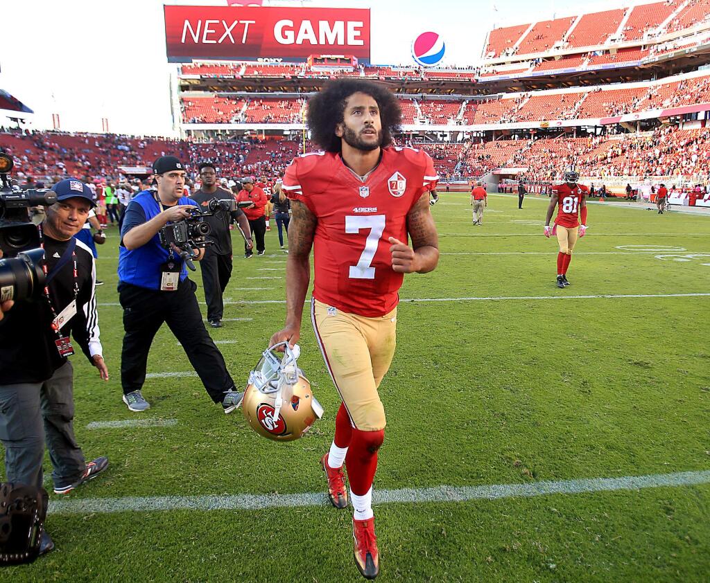 Colin Kaepernick heads to the locker room after the 49ers lost to the Buccaneers 34-17 at Levi's Stadium in Santa Clara, Sunday Oct. 23, 2016. (Kent Porter / The Press Democrat)