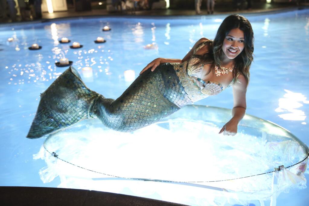 In this image released by The CW, Gina Rodriguez portrays Jane in the new series, 'Jane The Virgin.' (AP Photo/The CW, Tyler Golden)