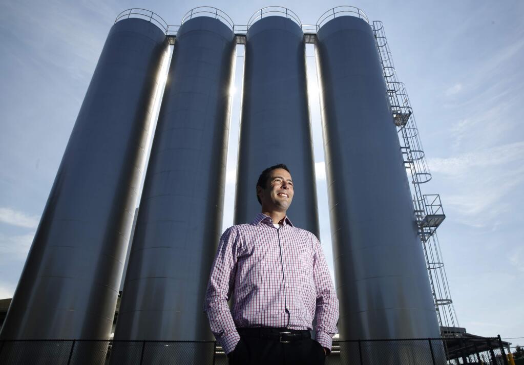 Clover Stornetta Farms President/CEO Marcus Benedetti stands in front of four new 50,000 gallon tanks which have been installed to help process the GMO-free milk. Photo taken on Tuesday, September 20, 2016 in Petaluma, California . (BETH SCHLANKER/ The Press Democrat)