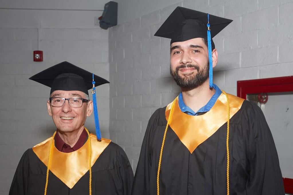 Information technology students Randall Lane and Chris Rivera, who spoke on behalf of the graduates at the Empire College School of Business commencement on July 25, 2016, at the Wells Fargo Center for the Arts in Santa Rosa. (STEVEN YEAGER)