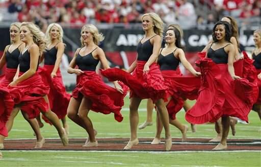 The Arizona Cardinals cheerleaders perform in honor of Hispanic Heritage Month during the first half of an NFL football game against the San Francisco 49ers, Sunday, Sept. 21, 2014, in Glendale, Ariz. (AP Photo/Rick Scuteri)