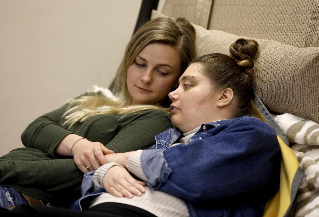 Chrissy Wilka, right, who has severe cerebral palsy, talks with Ashlie Mossberg, a direct support professional, at the Kaleidoscope Adult Day Program in Santa Rosa, on Thursday, March 8, 2018. (BETH SCHLANKER/ The Press Democrat)