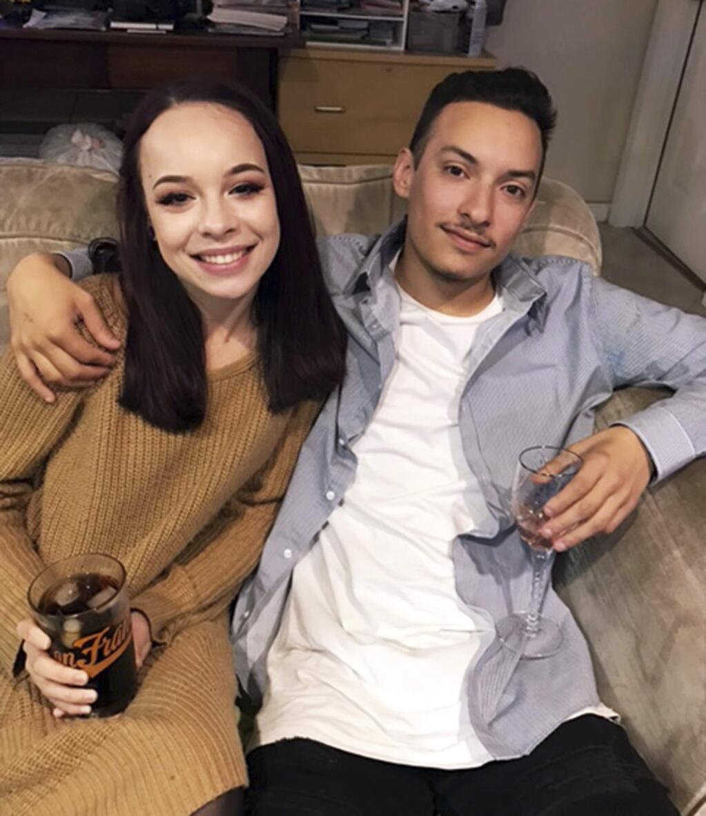 This undated photo provided by Kathy Vega shows Michela Gregory and Alex Vega. As of Tuesday, Dec. 6, 2016, Gregory was confirmed dead and Vega remained listed as missing in the disastrous fire that swept through an Oakland, Calif., warehouse party, killing dozens. (Kathy Vega via AP)