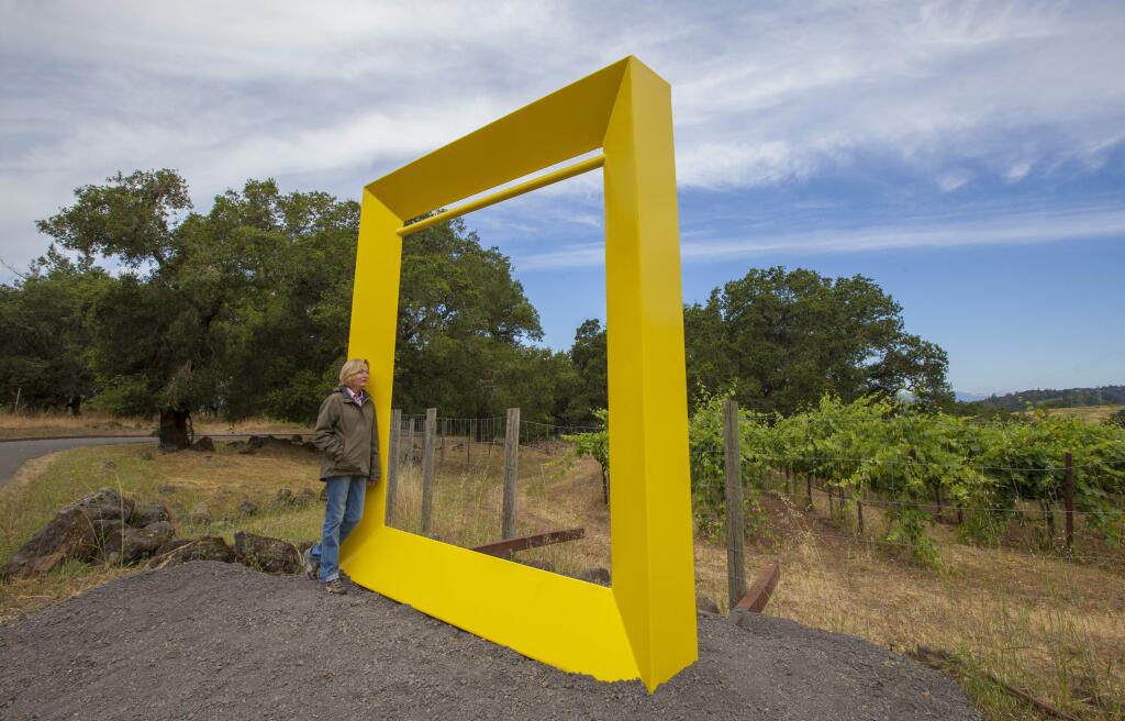 Curator Kate Eilertson leans on 'Frame,' by Robert Ellison, one of the sculptures currently on view at Paradise Ridge Winery. This show, 'Geometric Reflections,' will remain open until April 30, 2107. (Photos by Robbi Pengelly/Index-Tribune)