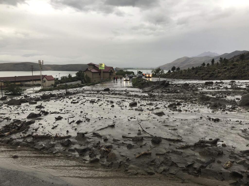 This image provided by Department of Public Safety/Nevada Highway Patrol Northern Command West shows mudslides on U.S. Highway 395 in Douglas County, Nev., north of the Nevada-California state line, Monday, May 21, 2018. The California Department of Transportation says Monday's mudslide is 100 feet (30.5 meters) in length and up to 4 feet (1.2 meters) deep. Nevada and California highway officials say there's no estimate for reopening the route in the area about 50 miles southeast of Lake Tahoe. (Public Safety/Nevada Highway Patrol Northern Command West via AP)