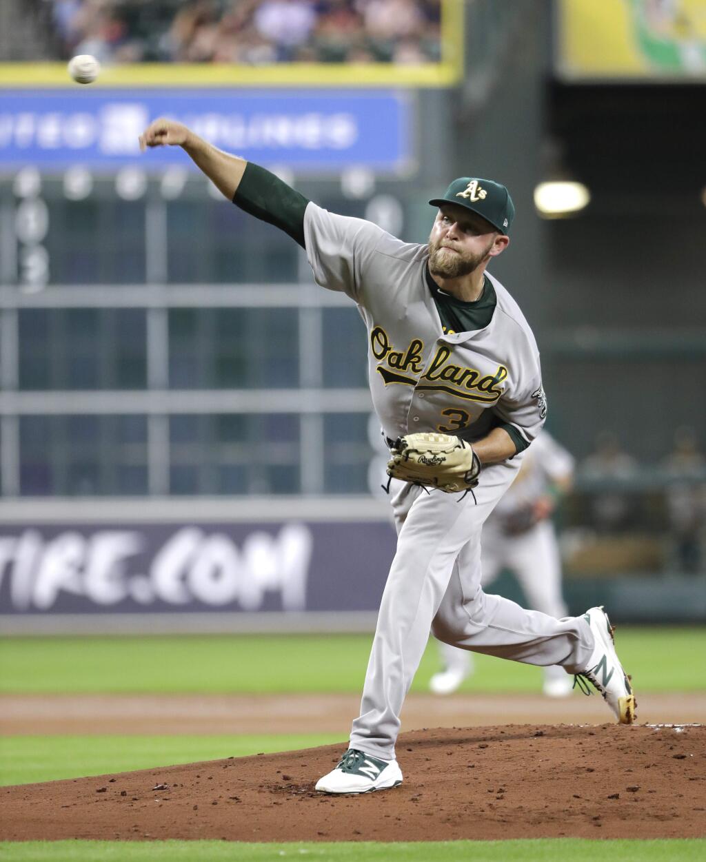 Oakland Athletics starting pitcher Jesse Hahn throws against the Houston Astros during the first inning of a baseball game, Wednesday, June 28, 2017, in Houston. (AP Photo/David J. Phillip)