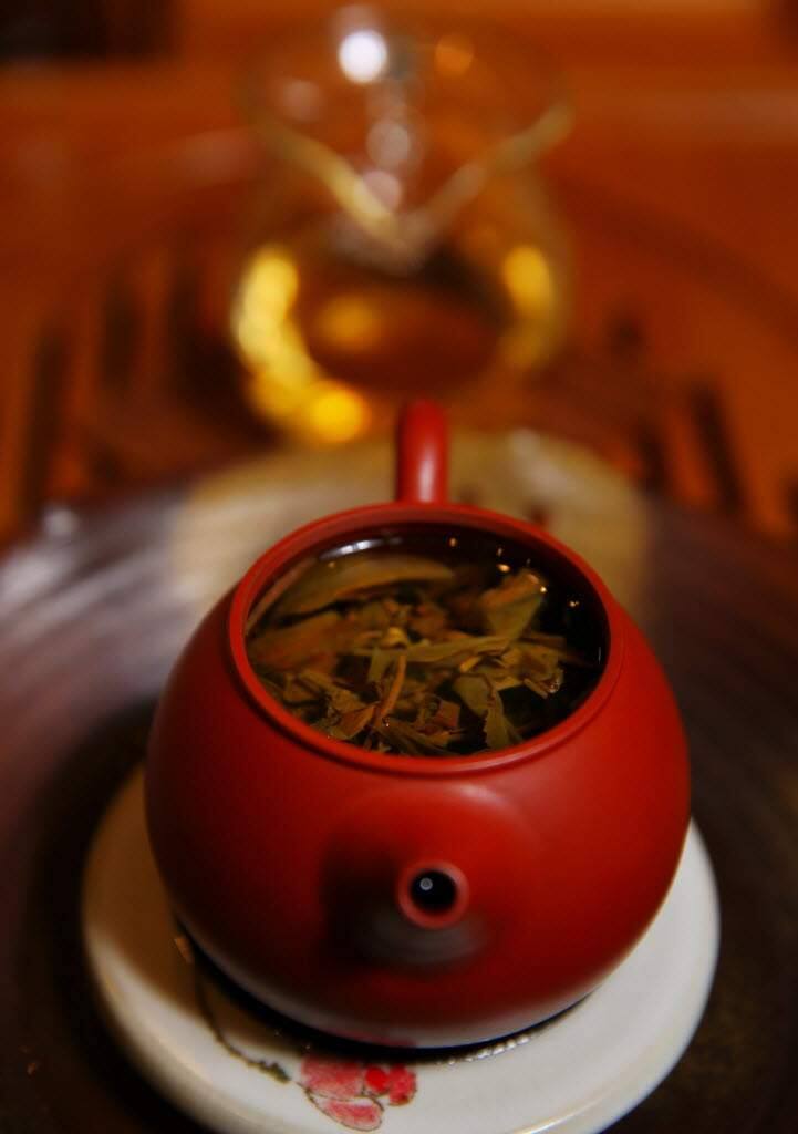 Puer tea steeps in a clay pot at Pure Puer Tea (Christopher Chung/The Press Democrat)