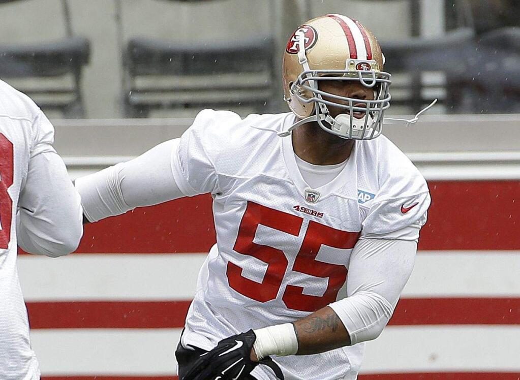 Ahmad Brooks and the rest of the linebacking corps presents one of the problems facing the team as they approach the 2015 season. (Jeff Chiu / Associated Press)
